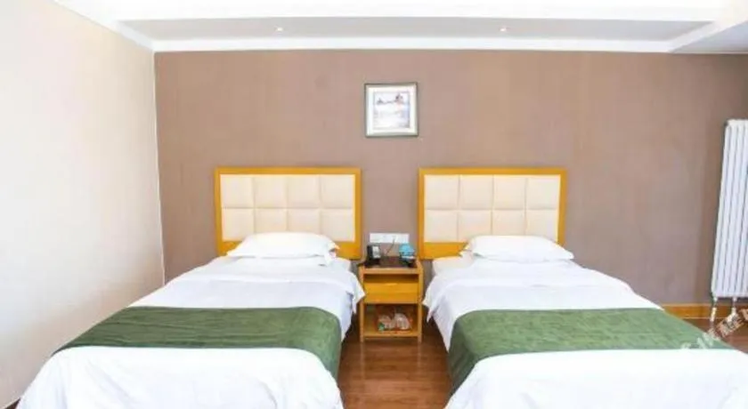 Bed in GreenTree Inn Shandong Taian Feicheng Xincheng Road Business Hotel
