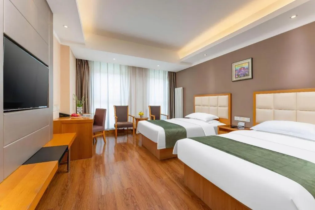 Bed in GreenTree Inn Shandong Taian Feicheng Xincheng Road Business Hotel