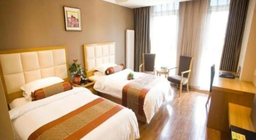 Bed in GreenTree Inn Shandong Taian Feicheng Xincheng Road Business Hotel