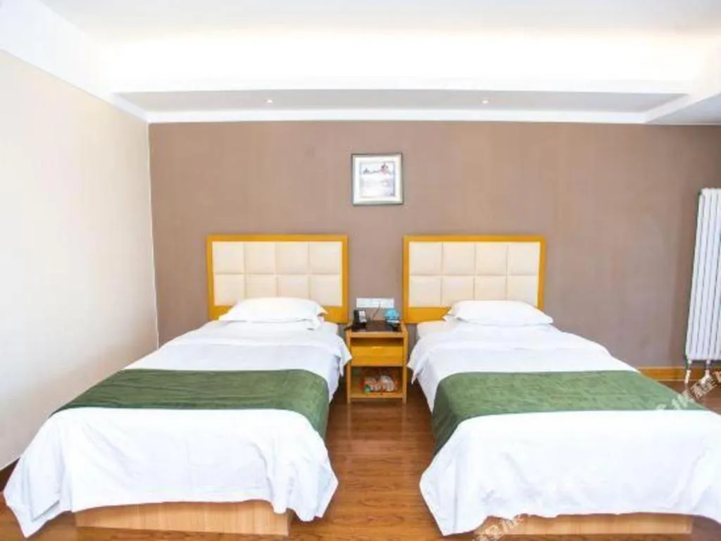 Bed in GreenTree Inn Shandong Taian Feicheng Xincheng Road Business Hotel