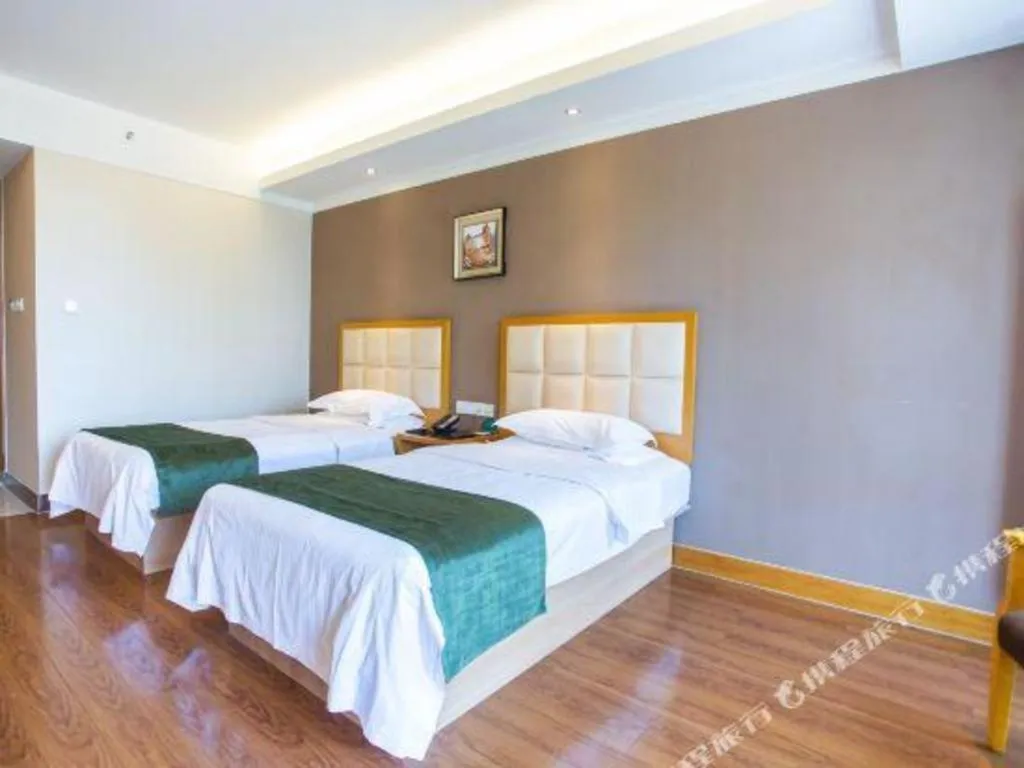 Bed in GreenTree Inn Shandong Taian Feicheng Xincheng Road Business Hotel