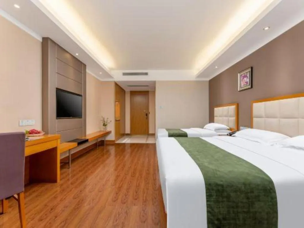 Bed in GreenTree Inn Shandong Taian Feicheng Xincheng Road Business Hotel