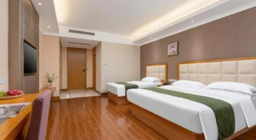 Bed in GreenTree Inn Shandong Taian Feicheng Xincheng Road Business Hotel
