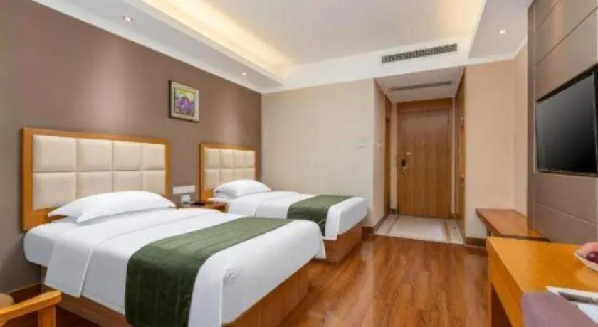 Bed in GreenTree Inn Shandong Taian Feicheng Xincheng Road Business Hotel