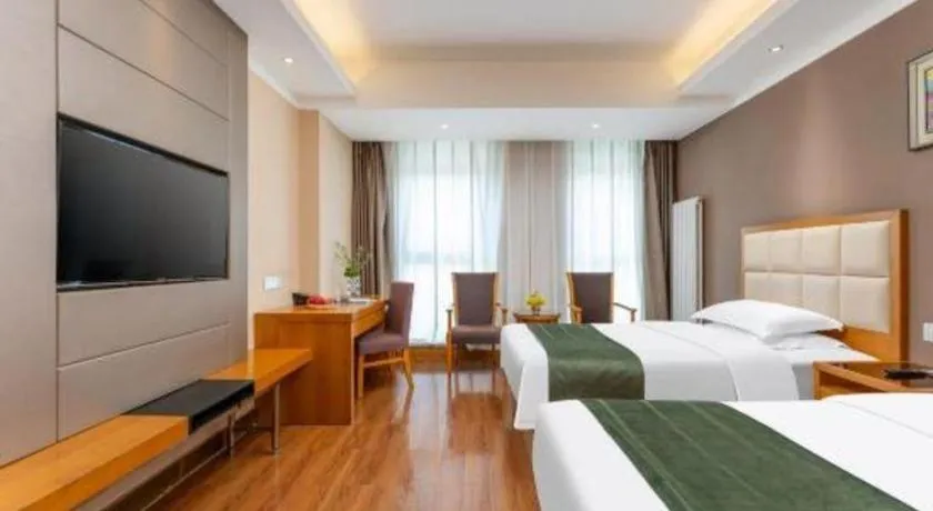 Bed in GreenTree Inn Shandong Taian Feicheng Xincheng Road Business Hotel