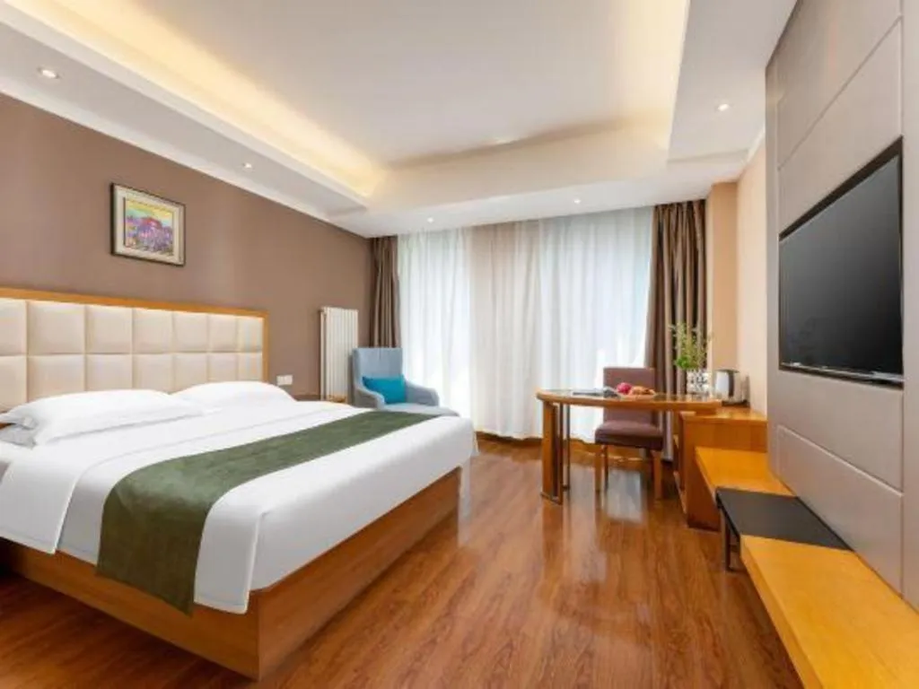 Bed in GreenTree Inn Shandong Taian Feicheng Xincheng Road Business Hotel