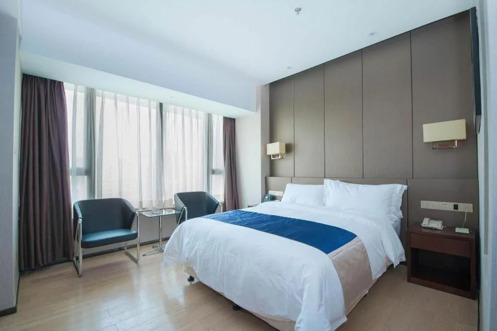 Bed in FOGER YACHT HOTEL