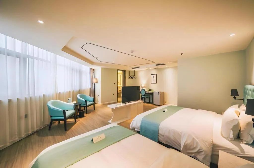 Bed in Qingdao Galaxy Holiday Hotel