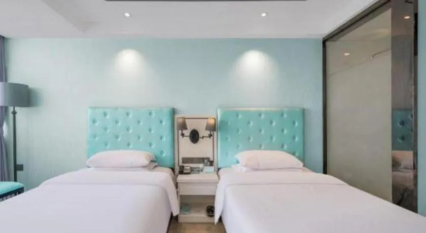 Bed in Qingdao Galaxy Holiday Hotel