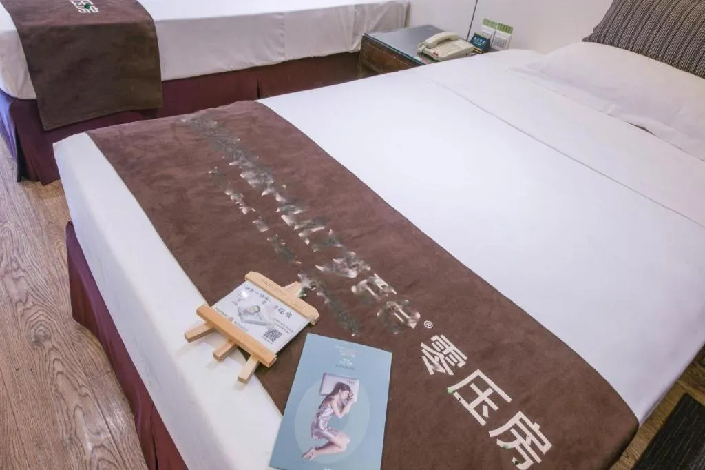 Bed in Tianjin Juchuan Lily Hotel