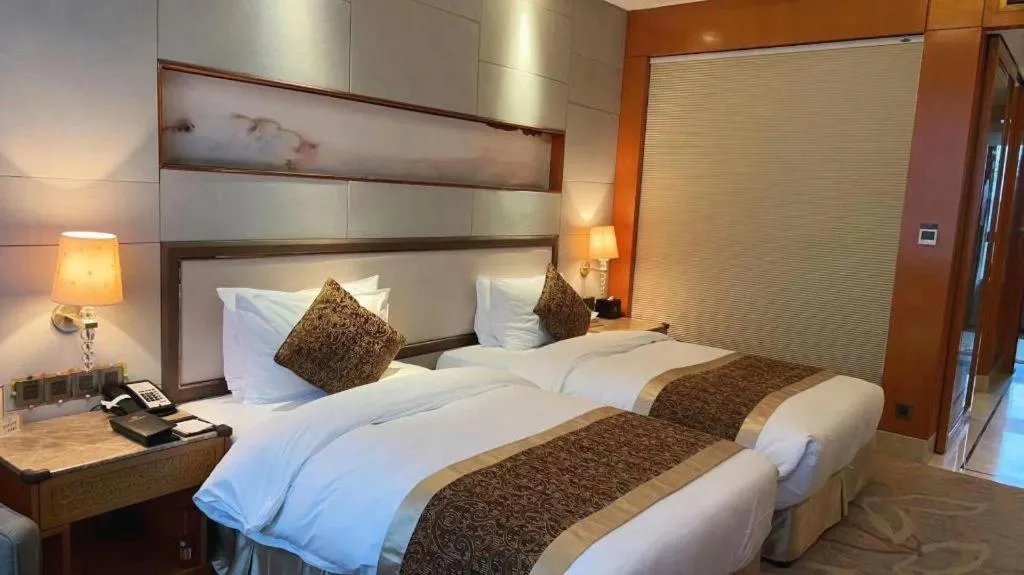 Bed in Mingdu Ziwei Garden Hotel