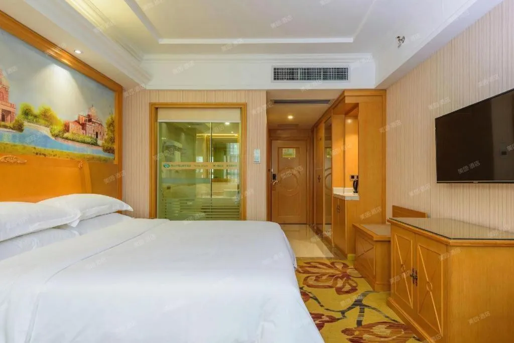 Bed in Vienna Hotel Guangxi Liuzhou Xijiang Vientiane City