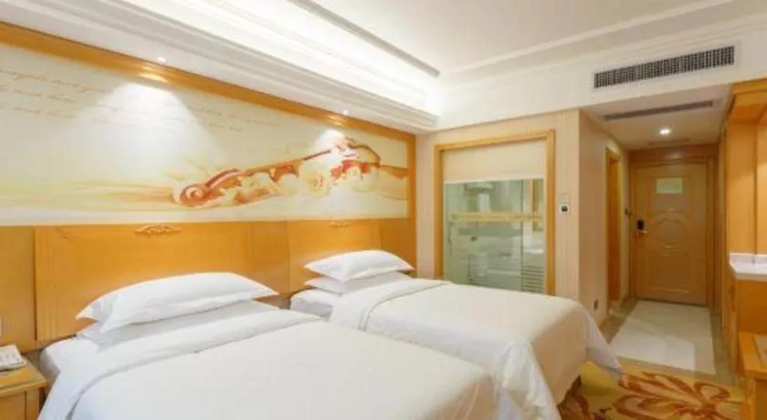 Bed in Vienna Hotel Guangxi Liuzhou Xijiang Vientiane City