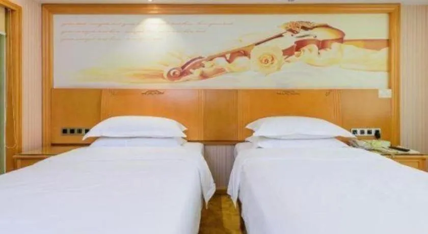 Bed in Vienna Hotel Guangxi Liuzhou Xijiang Vientiane City