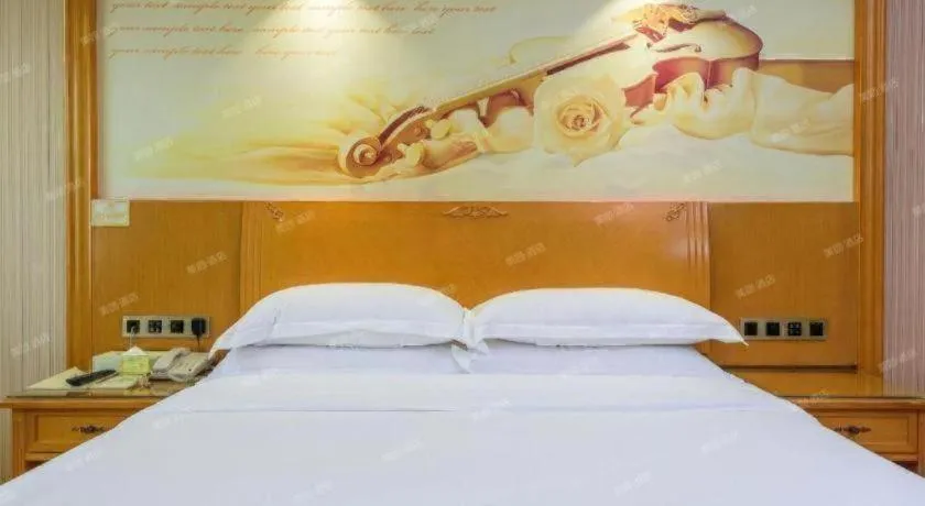 Bed in Vienna Hotel Guangxi Liuzhou Xijiang Vientiane City