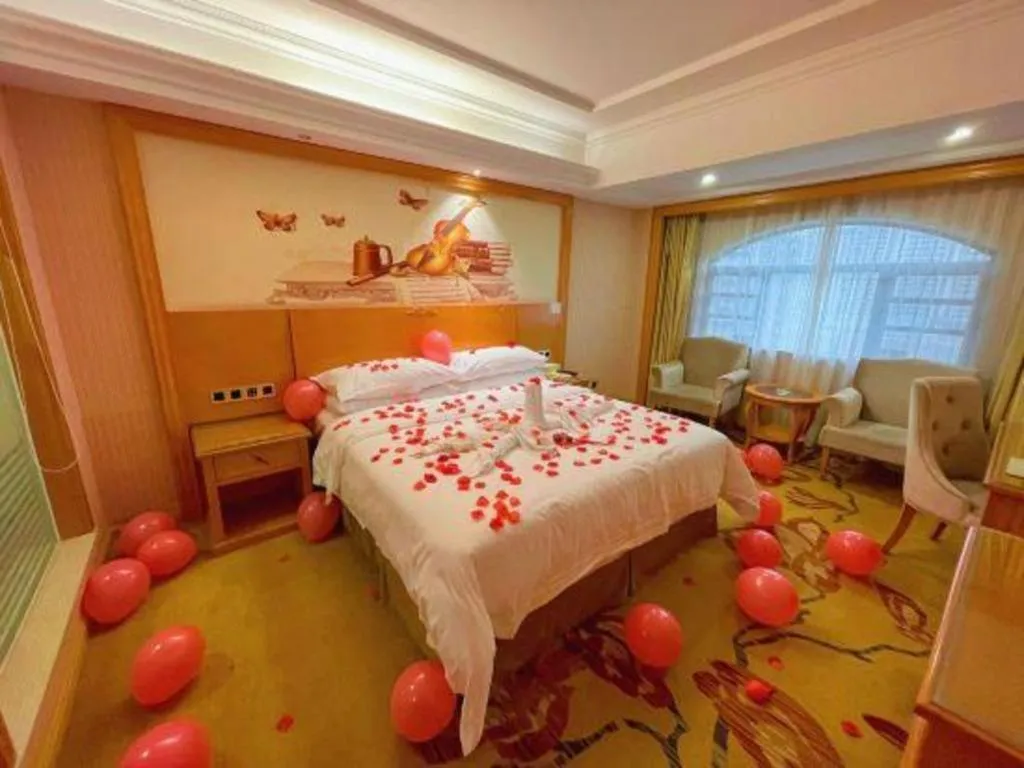 Bed in Vienna Hotel Guangxi Liuzhou Xijiang Vientiane City