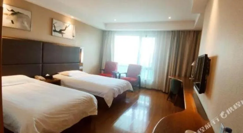 Bed in Warmly Hotel Suzhou Shuanghuwan