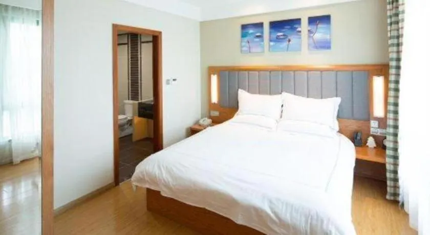 Bed in Warmly Hotel Suzhou Shuanghuwan