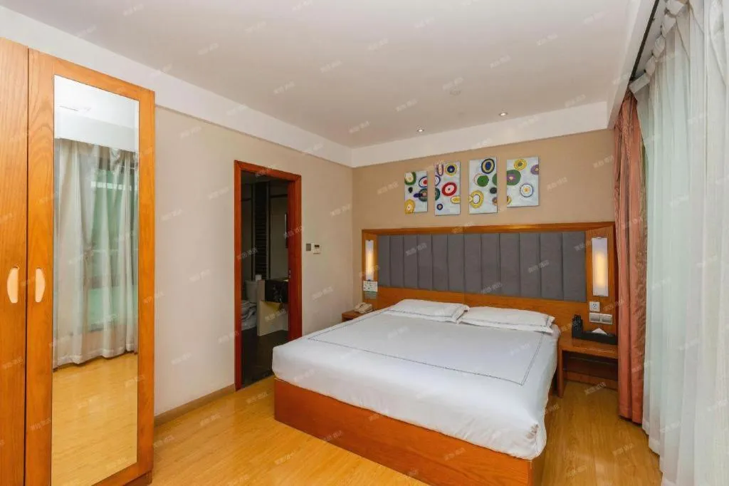 Bed in Warmly Hotel Suzhou Shuanghuwan