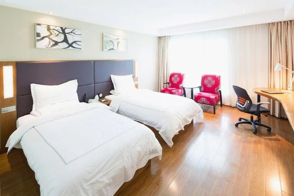 Bed in Warmly Hotel Suzhou Shuanghuwan