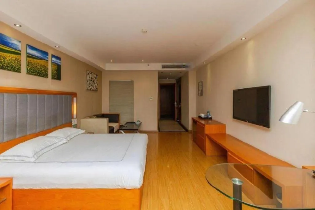 Bed in Warmly Hotel Suzhou Shuanghuwan