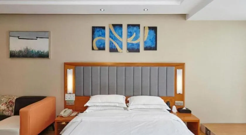 Bed in Warmly Hotel Suzhou Shuanghuwan