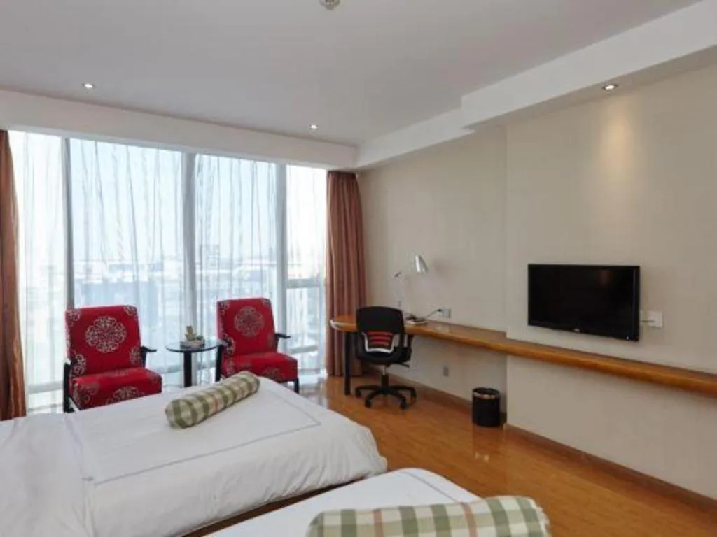 Bed in Warmly Hotel Suzhou Shuanghuwan