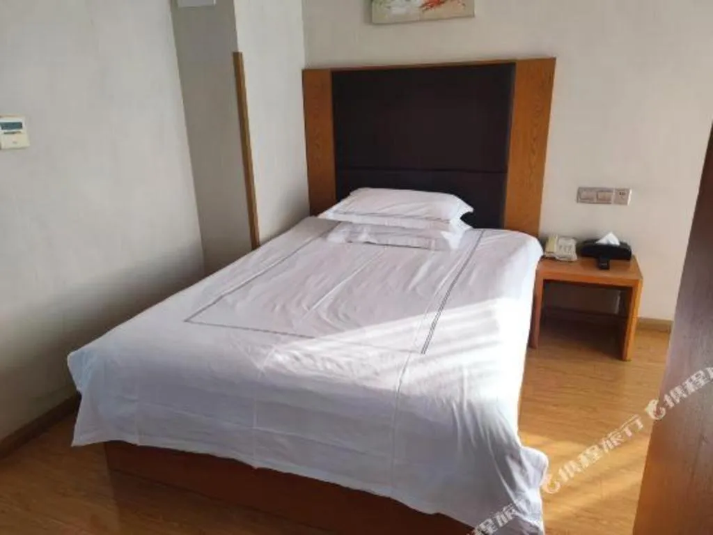 Bed in Warmly Hotel Suzhou Shuanghuwan