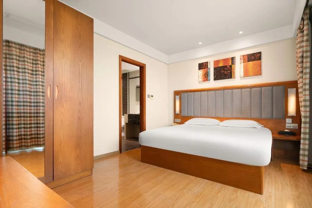 Bed in Warmly Hotel Suzhou Shuanghuwan