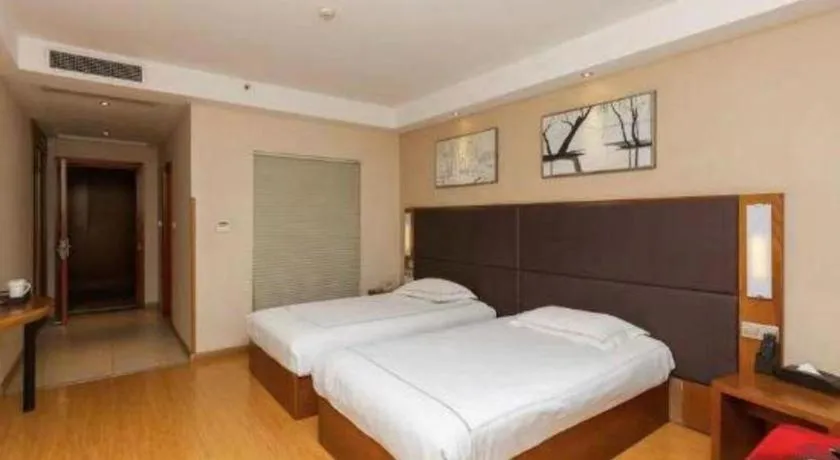 Bed in Warmly Hotel Suzhou Shuanghuwan