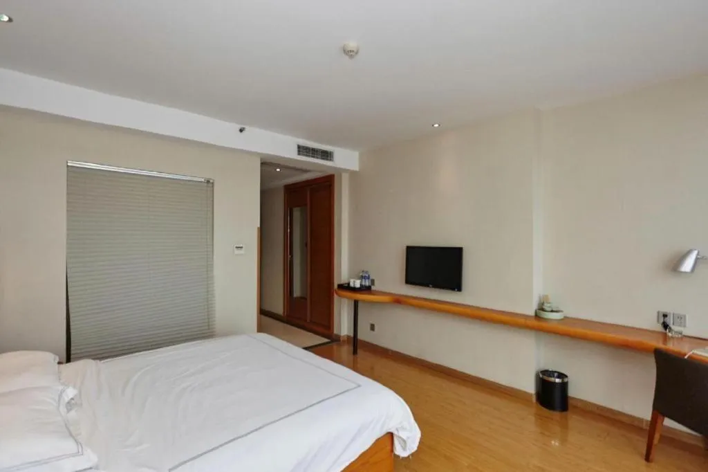 Bed in Warmly Hotel Suzhou Shuanghuwan