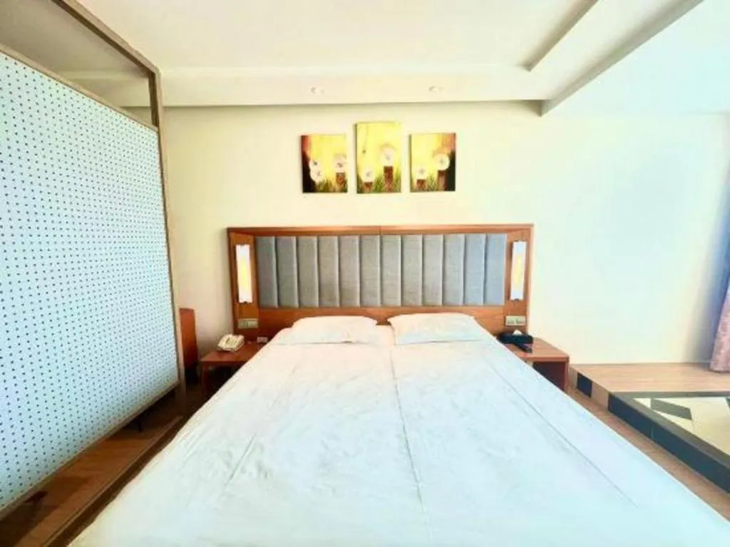 Bed in Warmly Hotel Suzhou Shuanghuwan