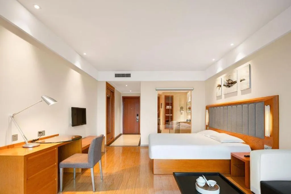 Bed in Warmly Hotel Suzhou Shuanghuwan