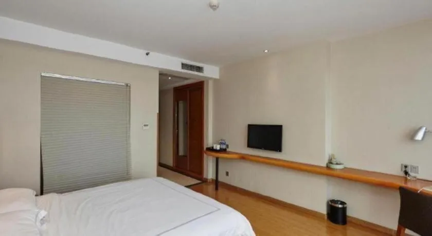 Bed in Warmly Hotel Suzhou Shuanghuwan