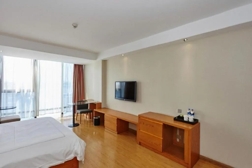 Bed in Warmly Hotel Suzhou Shuanghuwan