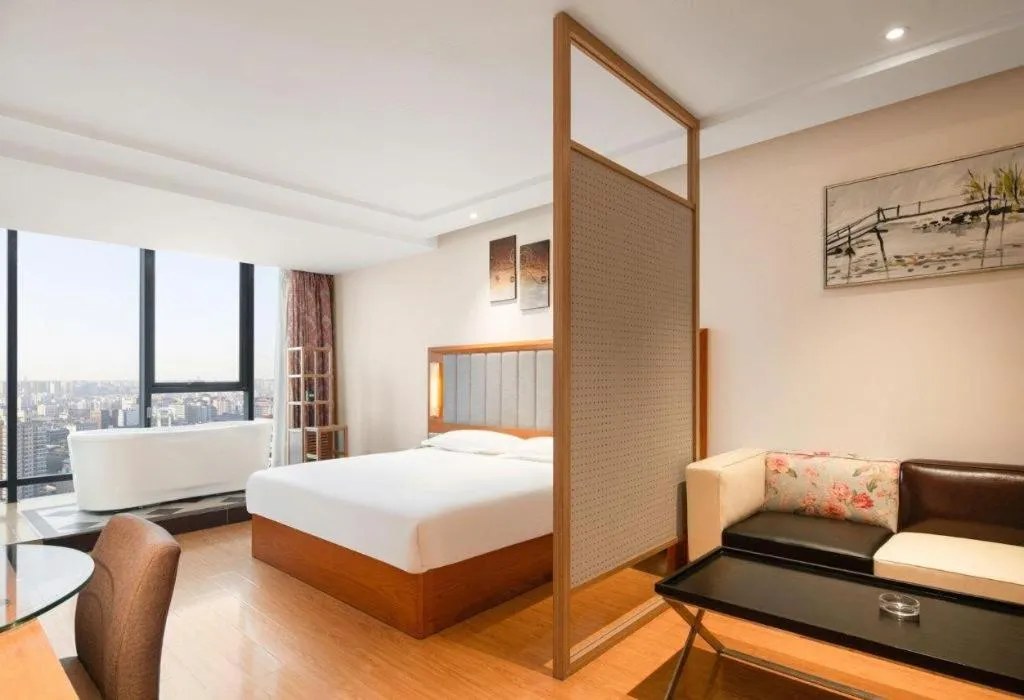 Bed in Warmly Hotel Suzhou Shuanghuwan