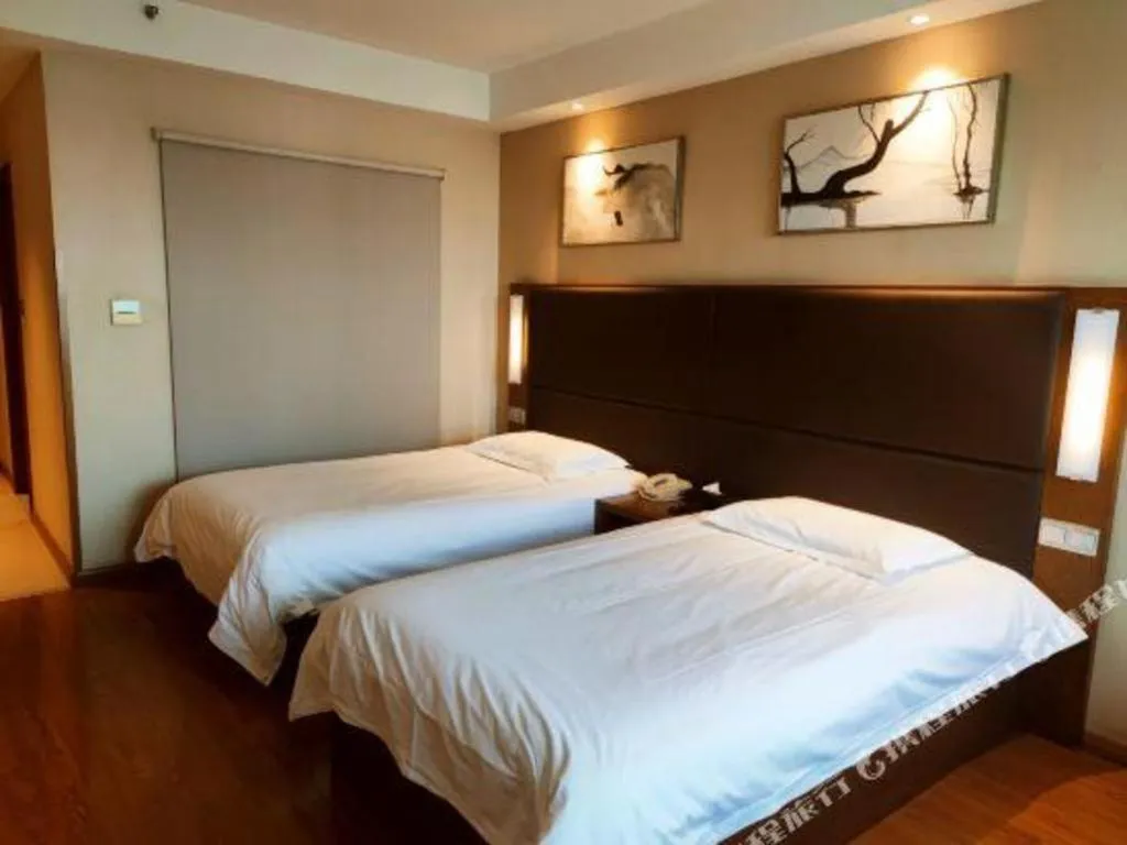 Bed in Warmly Hotel Suzhou Shuanghuwan