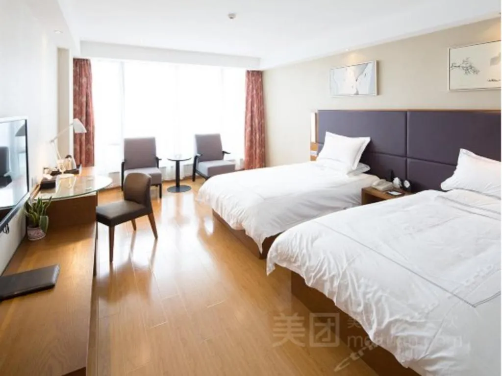 Bed in Warmly Hotel Suzhou Shuanghuwan