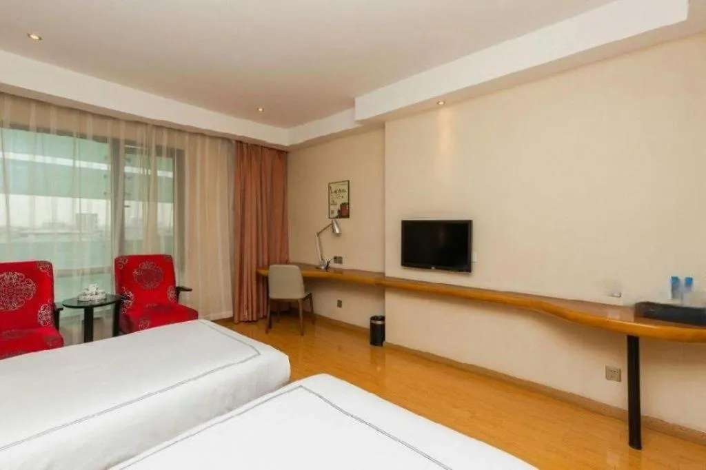 Bed in Warmly Hotel Suzhou Shuanghuwan