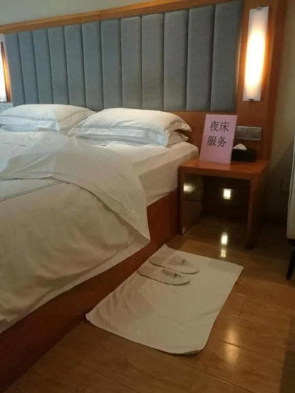 Bed in Warmly Hotel Suzhou Shuanghuwan