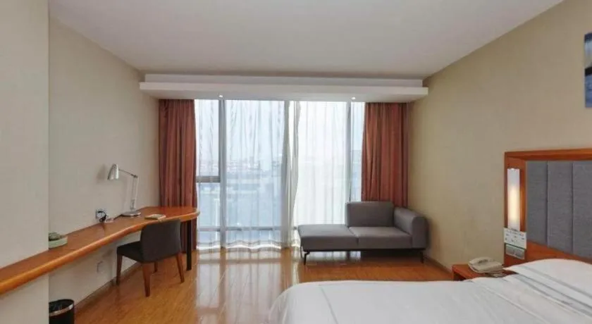 Bed in Warmly Hotel Suzhou Shuanghuwan