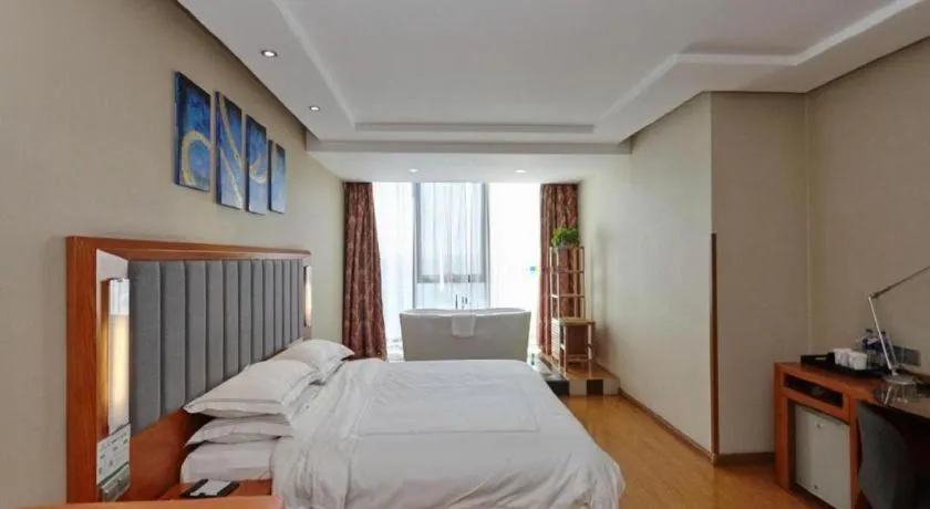 Bed in Warmly Hotel Suzhou Shuanghuwan