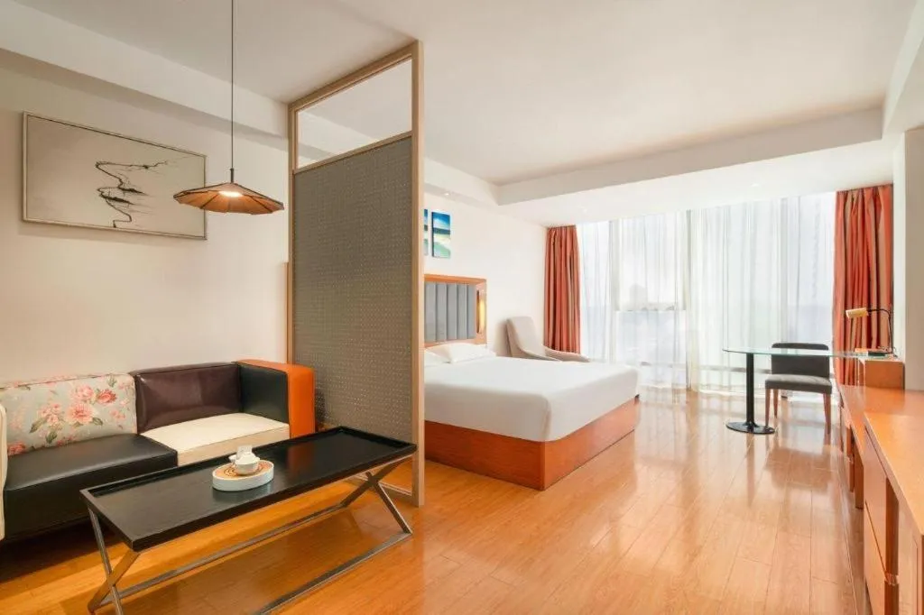 Bed in Warmly Hotel Suzhou Shuanghuwan