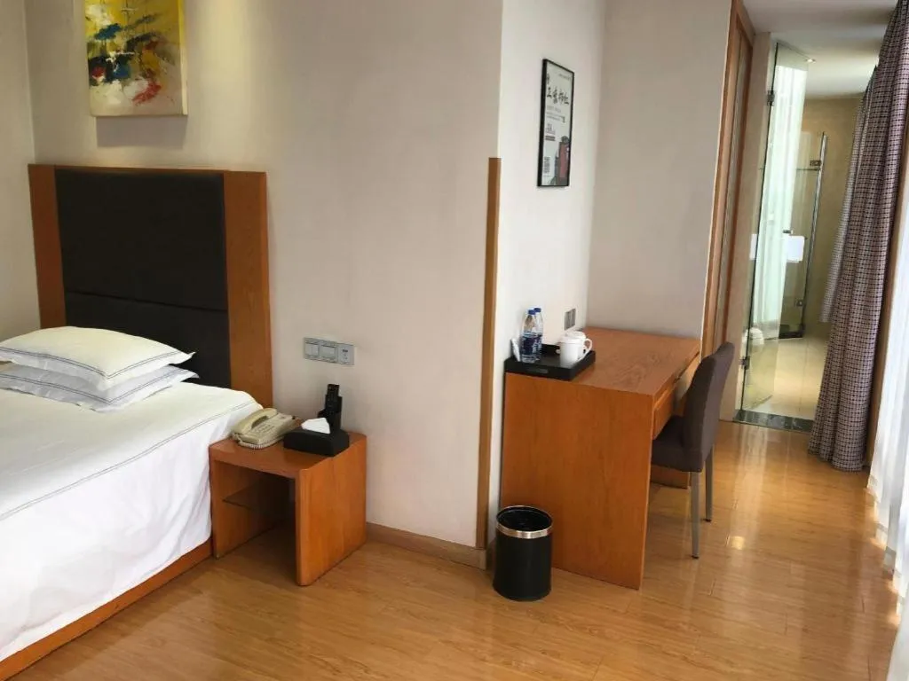 Bed in Warmly Hotel Suzhou Shuanghuwan