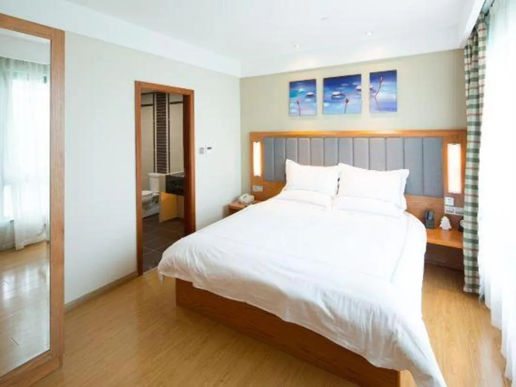 Bed in Warmly Hotel Suzhou Shuanghuwan