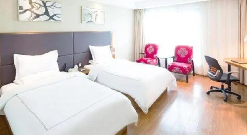 Bed in Warmly Hotel Suzhou Shuanghuwan