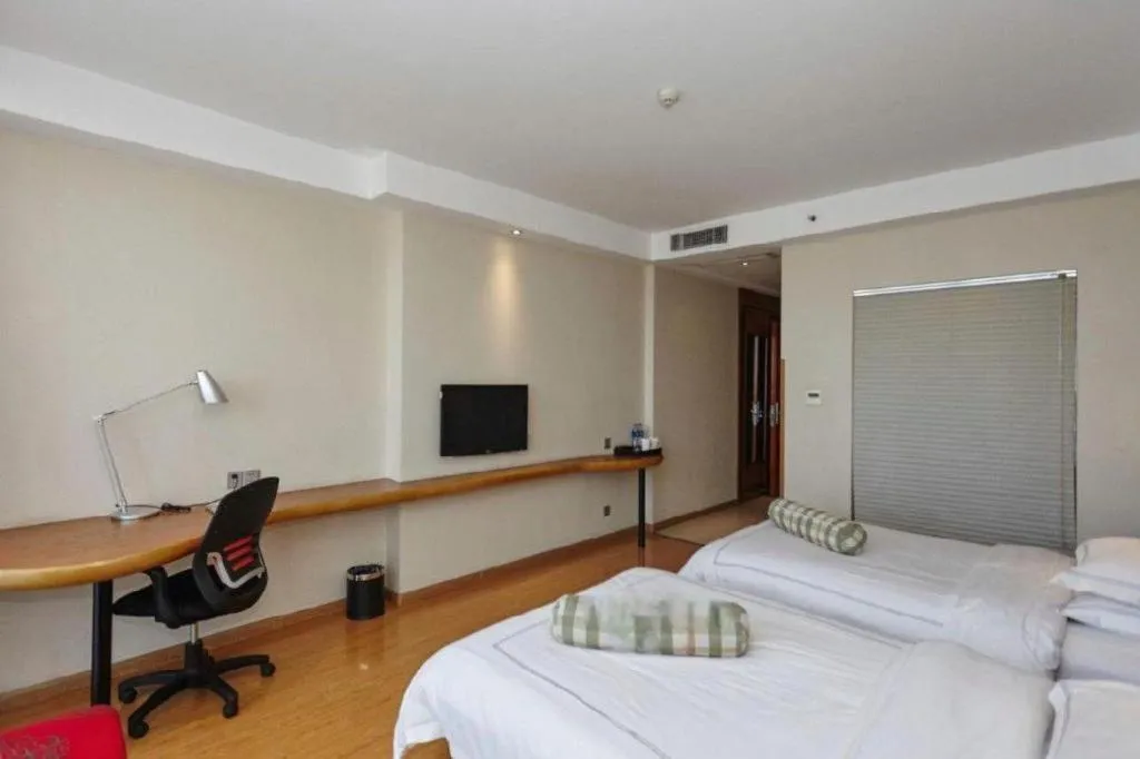 Bed in Warmly Hotel Suzhou Shuanghuwan