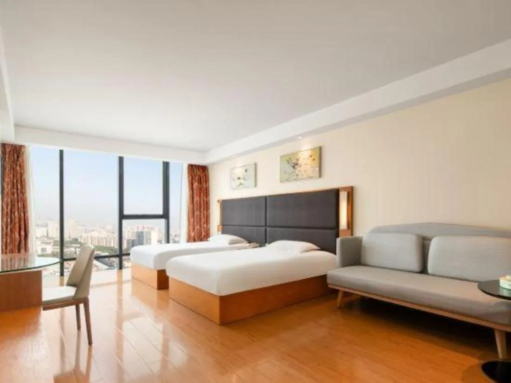 Bed in Warmly Hotel Suzhou Shuanghuwan