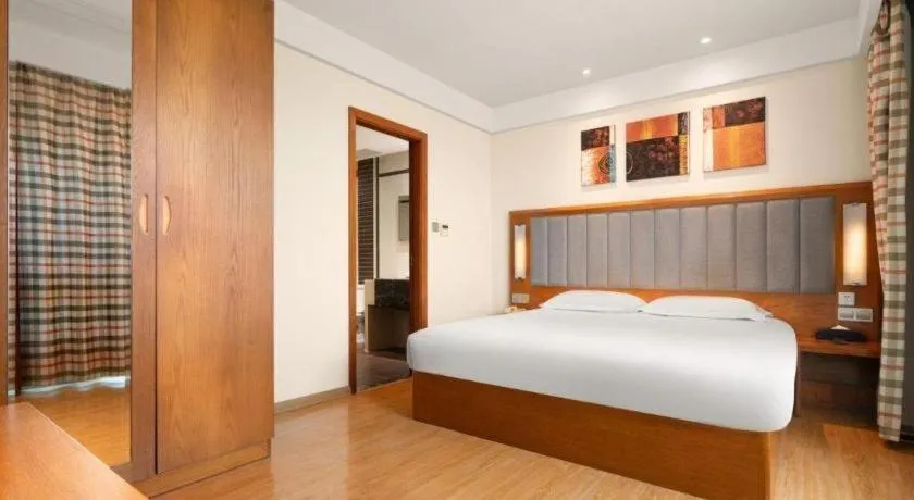 Bed in Warmly Hotel Suzhou Shuanghuwan