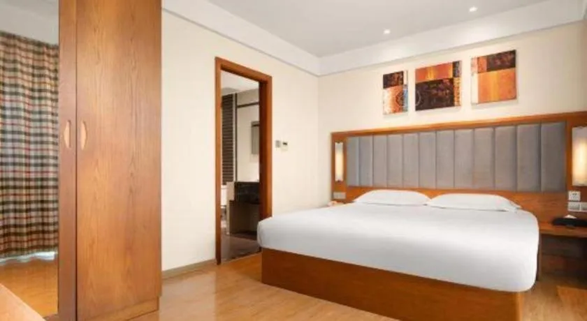 Bed in Warmly Hotel Suzhou Shuanghuwan